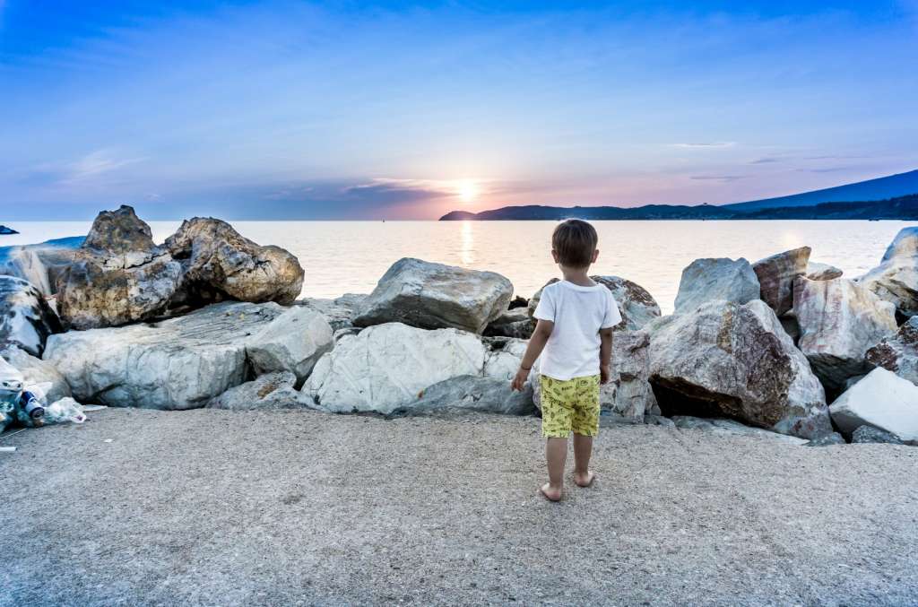 Child Looking Out To Sea